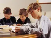 boys studying spelling bee words