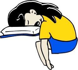 Girl asleep, with her head in a book