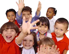 group of happy preschool students, raising their hands